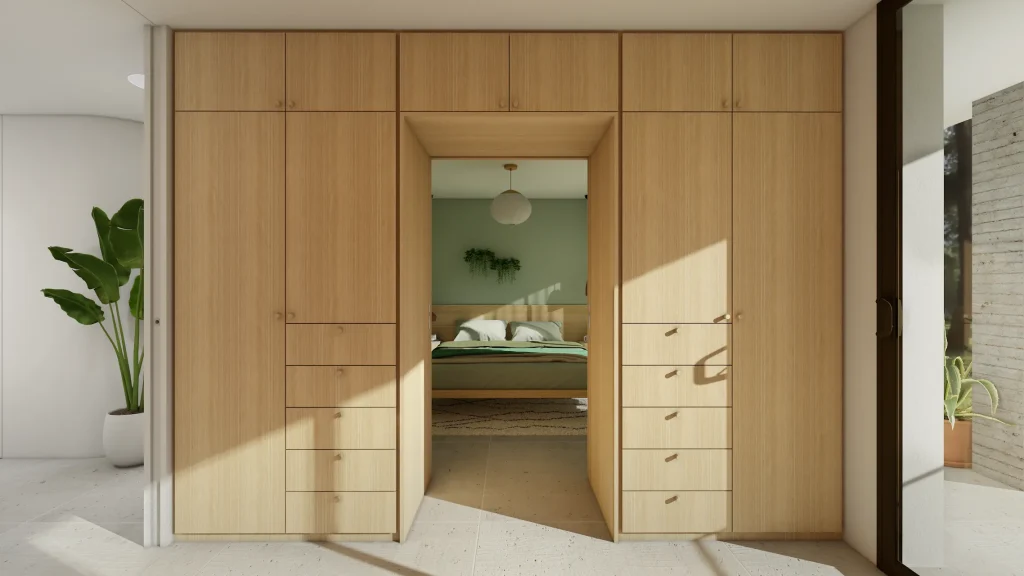 Dressing en chêne avec une double porte coulissante ouvrant sur la chambre parentale