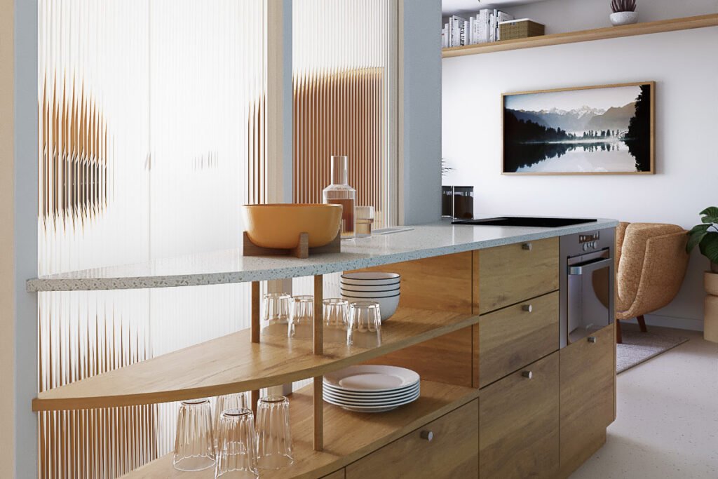 Vue 3D de la cuisine ouverte avec îlot en bois arrondi intégrant rangements et étagères, adossé à une verrière en verre flûté.