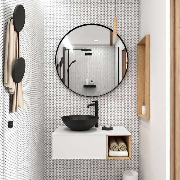 Petite salle d’eau en noir et blanc avec vasque ronde, miroir circulaire et niches en bois.